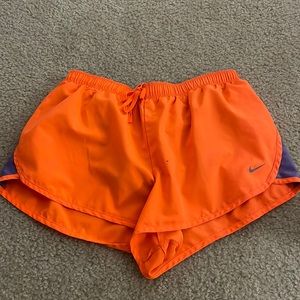 Neon orange Nike shorts